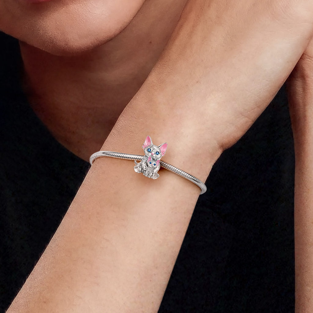 Gnoce Devon Cat Embraces Baby Charm_2